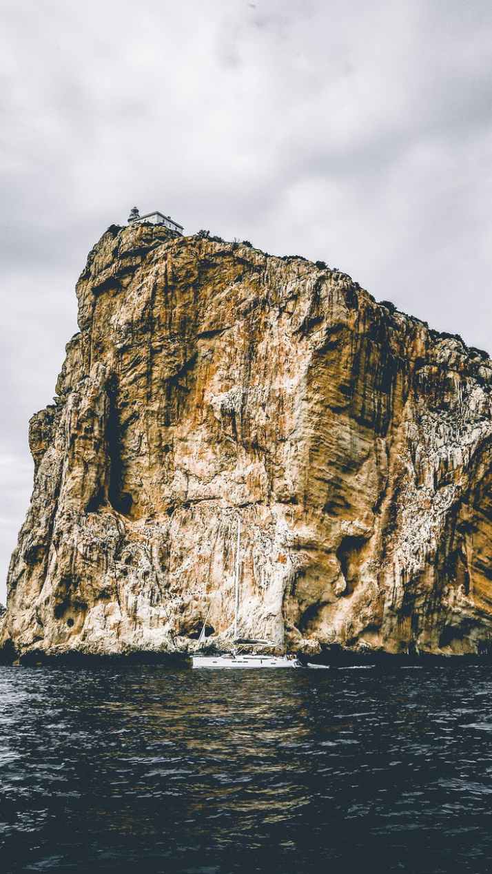 white boat on body of water